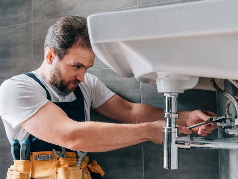 Sewage Clean Up 11 Plumber repairing Drain